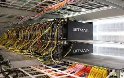 A large-scale mining farm showcasing rows of mining rigs in a climate-controlled environment.